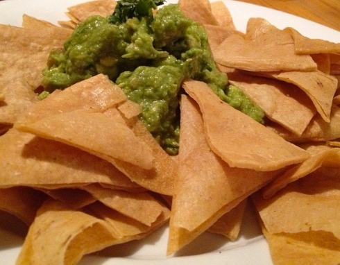 We can't decide what's more impressive, the fresh, tangy guacamole, or the crisp, home-made tortilla chips that encircle it.