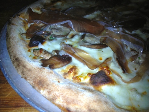 The thin-crust brick-oven pizza is served until 2 in the morning. We recommend this truffle-soaked speck and mushroom pie.