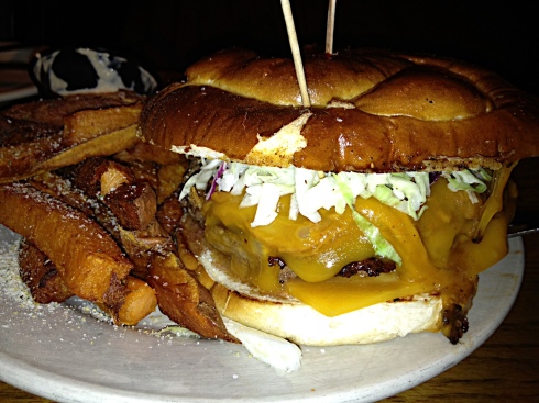This is the customer burger contest winner: "The Tom Halvorson BBQ Slaw Burger" on a slightly sweet and chewy pretzel bun. The medium-rare beef is topped with BBQ pork, two slices of cheddar, and fresh cole slaw. Unfortunately, the taste of the beef was lost amid all the toppings. The real star of the plate might be the garlicky sweet potato fries--and the accompanying house-made horseradish. Ask for extra.